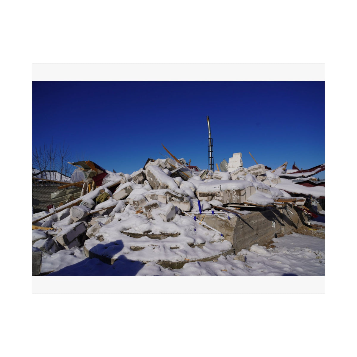 Snow on Rubble — photograph by Alex Frishberg